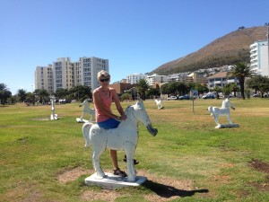 Sue on a rocking horse on the Sea Point Promenade.